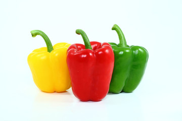 Yellow red green bell chili white isolate