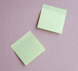 light green notepad on the wall