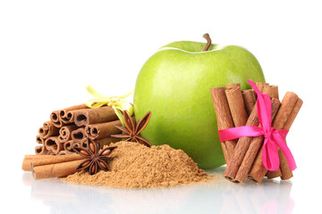 Cinnamon sticks, apple and anise isolated on white