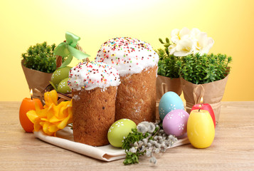Beautiful Easter cakes, colorful eggs and candles