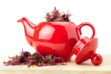 red teapot with healing herbs