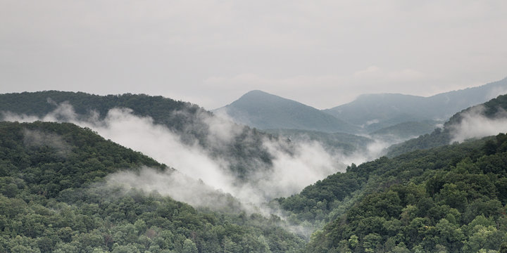 Fototapeta Fog and cloud mountain valley landscape