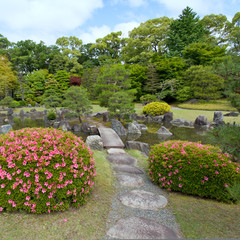 Zen Garden with bridge, plants, rocks and pond