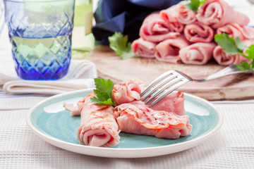 Grilled Ham rolls stuffed with cheese and parsley