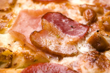 Italian pizza with bacon, salami and mozzarella cheese