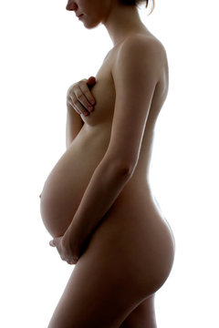 A silhouette of a beautiful pregnant woman
