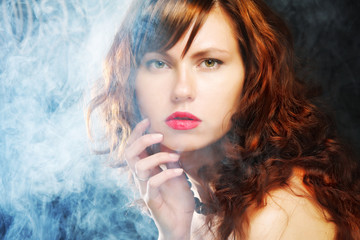 young and sexy woman in smoke