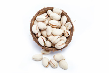 Pistachio nuts in the shell of the coconut.