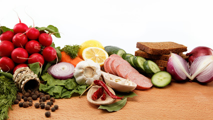 Healthy food. Fresh vegetables and fruits on a white background.