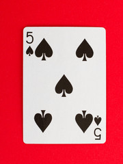 Old playing card (five) isolated
