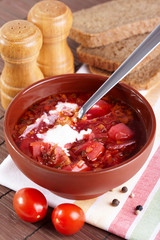 Russian cuisine. Borscht on the served table
