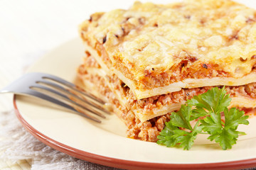 Italian cuisine. Meat lasagna on plate