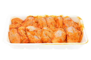 Raw chicken wings marinated