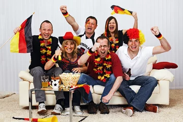 Poster german soccer fans on the sofa © Ingo Bartussek