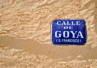 street sign of Goya in facade