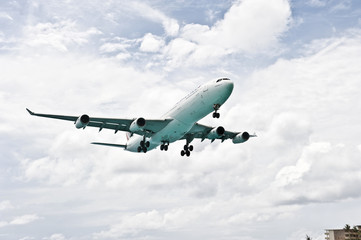 Fototapeta na wymiar Airplane Cloudy Skies