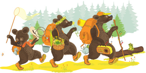Family of bears traveling on forest.