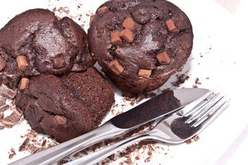 Brown muffins with chocolate on a plate
