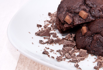 Brown muffins with chocolate on a plate