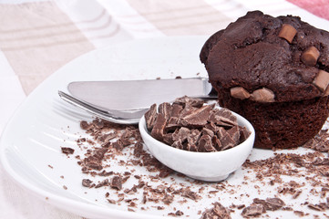 Brown muffins with chocolate and cutlery