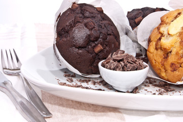 Mixed fresh baked muffins on a plate