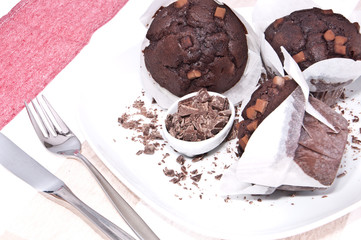 Fresh chocolate muffins on a plate
