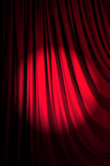 Brightly lit curtains in theatre concept