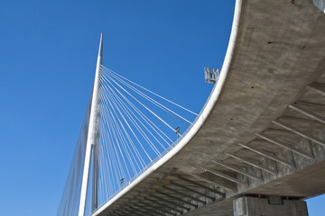 Overpass to bridge over blue sky