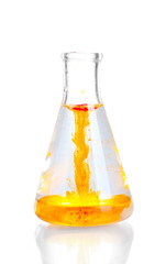 brightly ink in a flask with water isolated on white