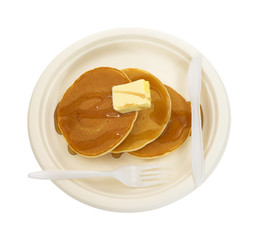 Buttered pancakes on paper plate