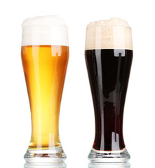 black and golden beer in glasses isolated on white