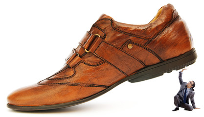 Woman domination concept with shoes and man