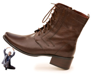 Woman domination concept with shoes and man