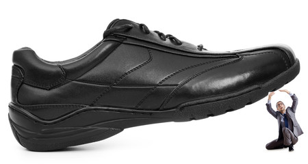 Woman domination concept with shoes and man