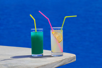 Two cocktails on table at beach