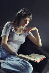 Relaxed young woman listening music