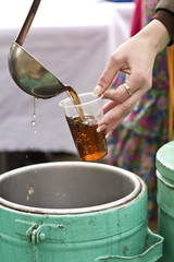 Pour tea in a disposable glass