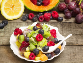 fruit salad with fruits background