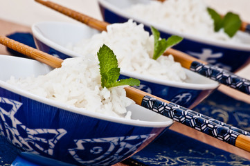 cups of basmati rice with chopsticks
