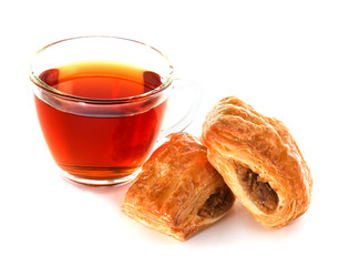 Cup of tea with cinnamon Danish bun