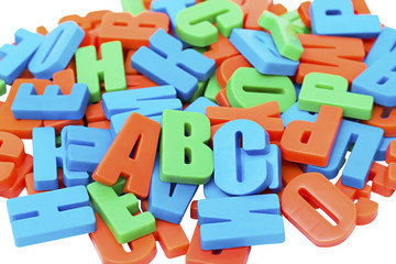 Naklejka premium Colorful alphabet letters on a magnet