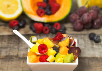 delicious fruit salad with red fruits in a  bowl
