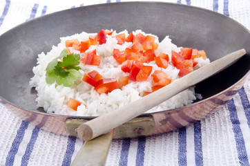 rice pan with diced red bell pepper