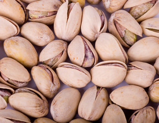 pistachios heap against white background