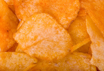 Tasty potato chips isolated on white