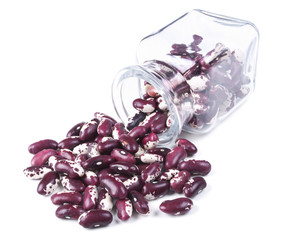 purple beans scattered on a white background