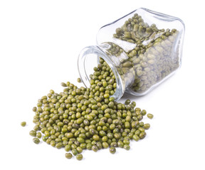 green mung scattered on a white background
