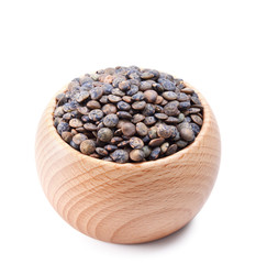 wooden bowl full of French lentils isolated on white