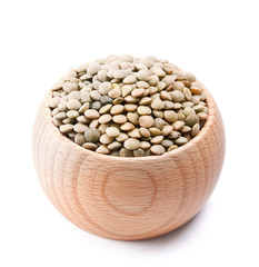 wooden bowl full of green lentils isolated on white