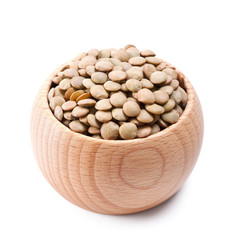 wooden bowl full of laird lentils isolated on white
